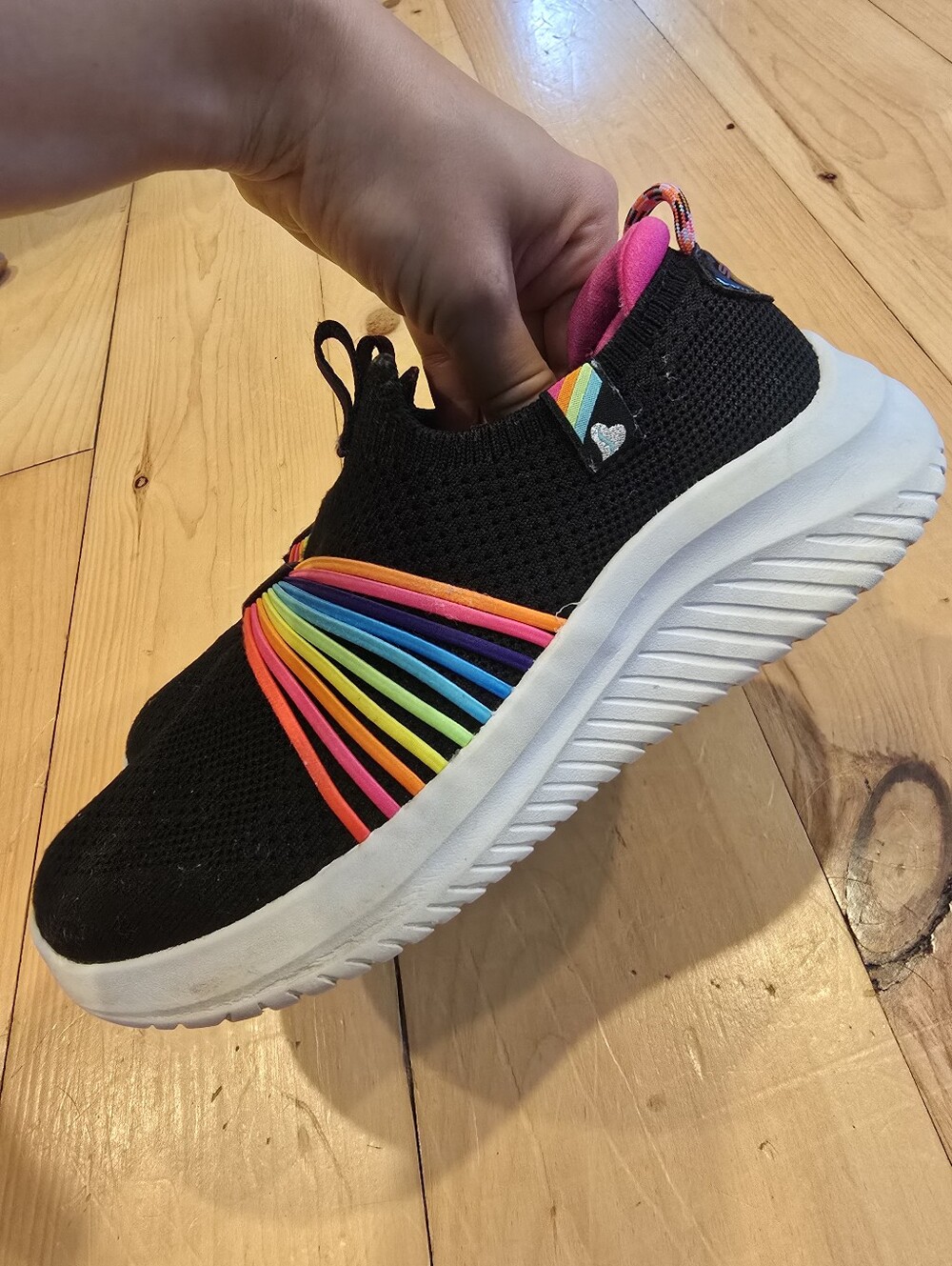 Kids Black Slip-On Sneakers with Rainbow Accents. Washable Skechers.